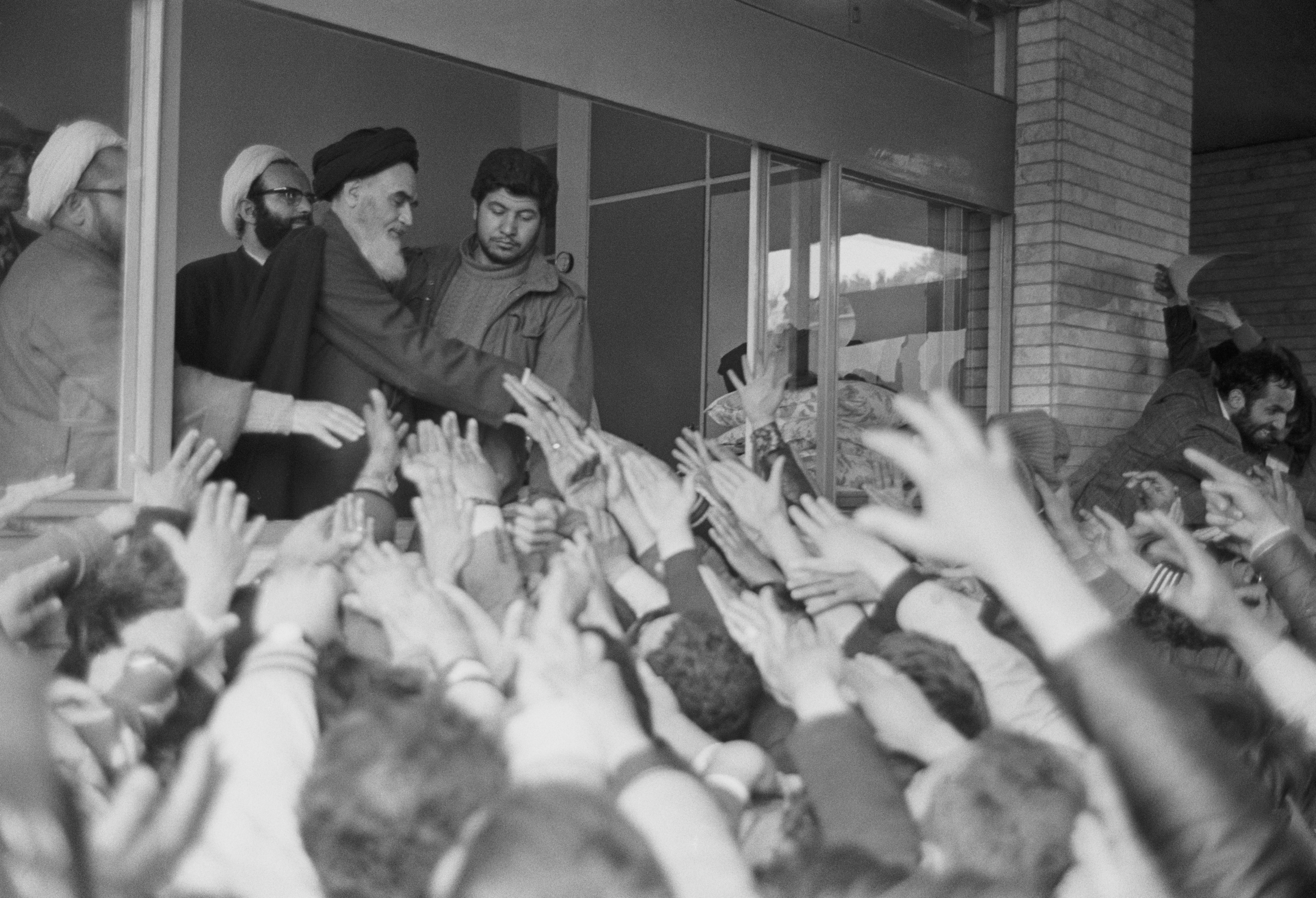 03 February, 1979 , Ayatollah Ruhollah Khomeini greets the crowd at Tehran University after his return to Iran from exile in France during the Iranian Revolution.
