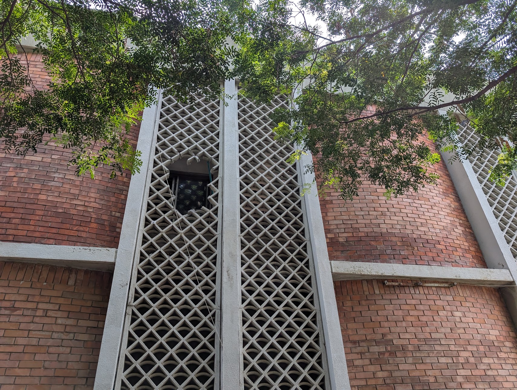 Rescue workers had to break the concrete grill, and then the window to gain access inside the ward to carry out rescue. [Abid Hussain/Al Jazeera]