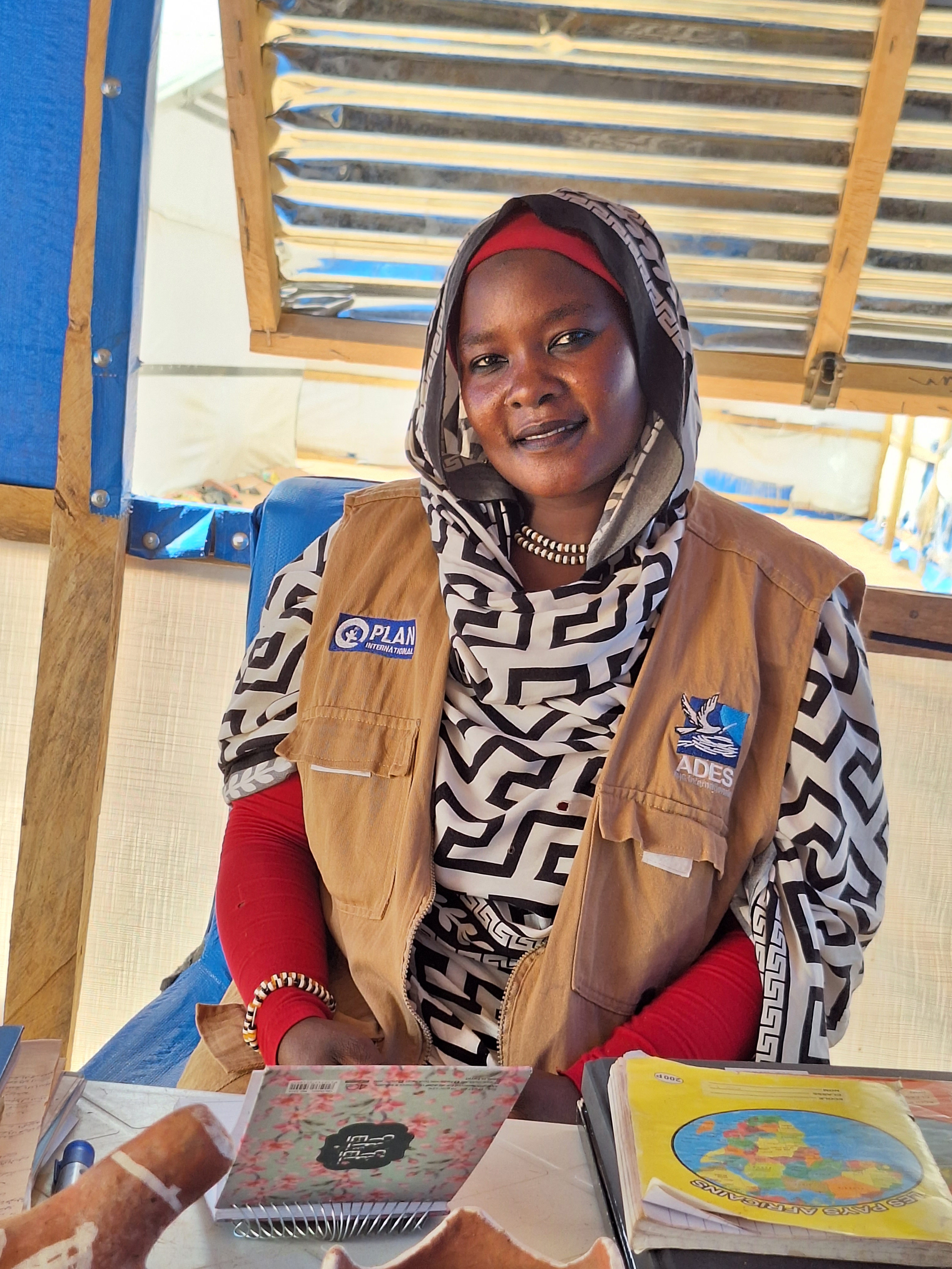 Sarah, 32, fled her country, Sudan, with her parents and three sisters in June 2023 to seek safety in Chad. She says she hopes to return home when peace returns to Sudan. [Courtesy of Plan International]