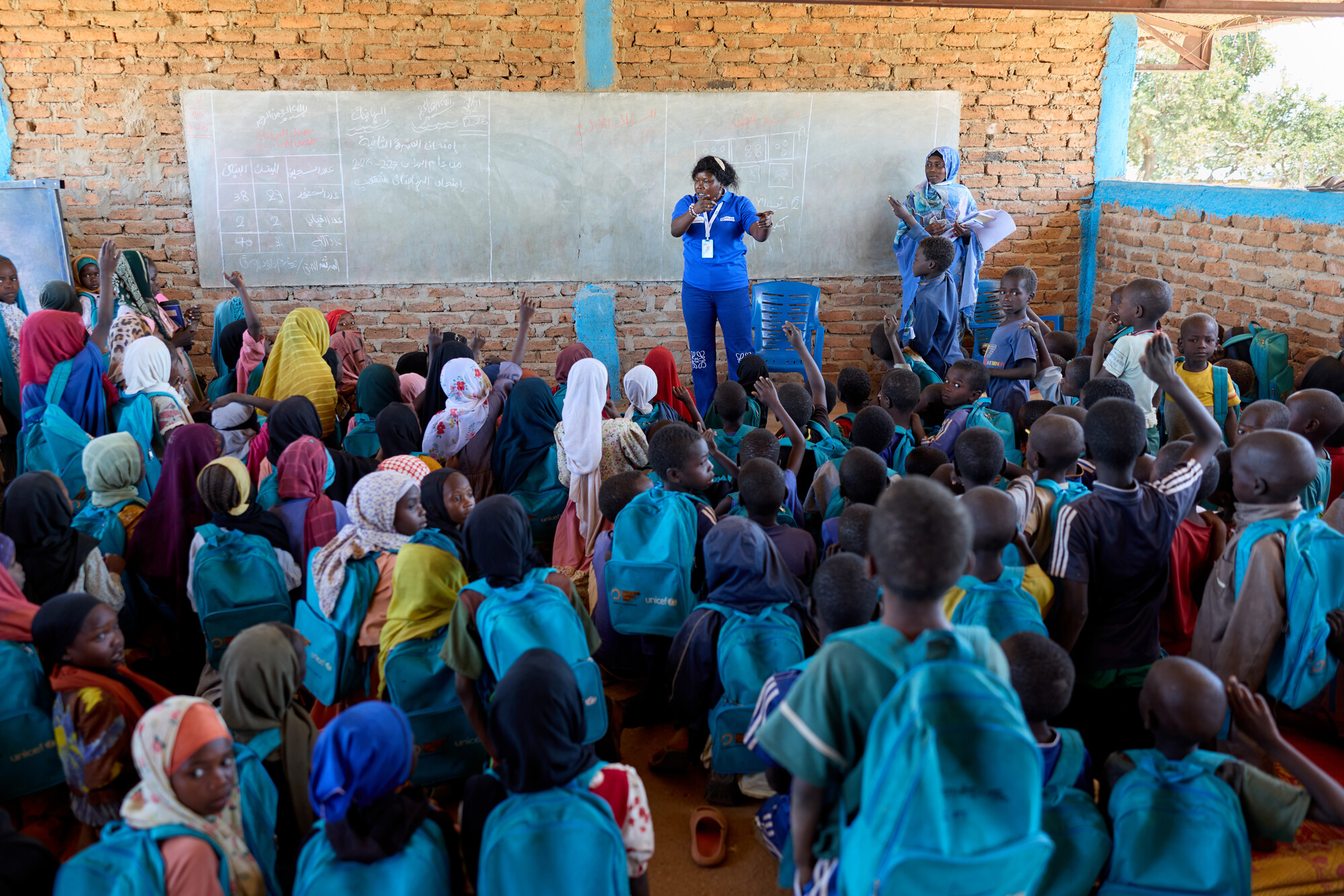 Arlette, a Child-Friendly Space supervisor at Aboutengue refugee camp in eastern Chad, supports children displaced by the war in Sudan by providing a safe place to play, learn and recover from trauma. [Courtesy of Plan International]