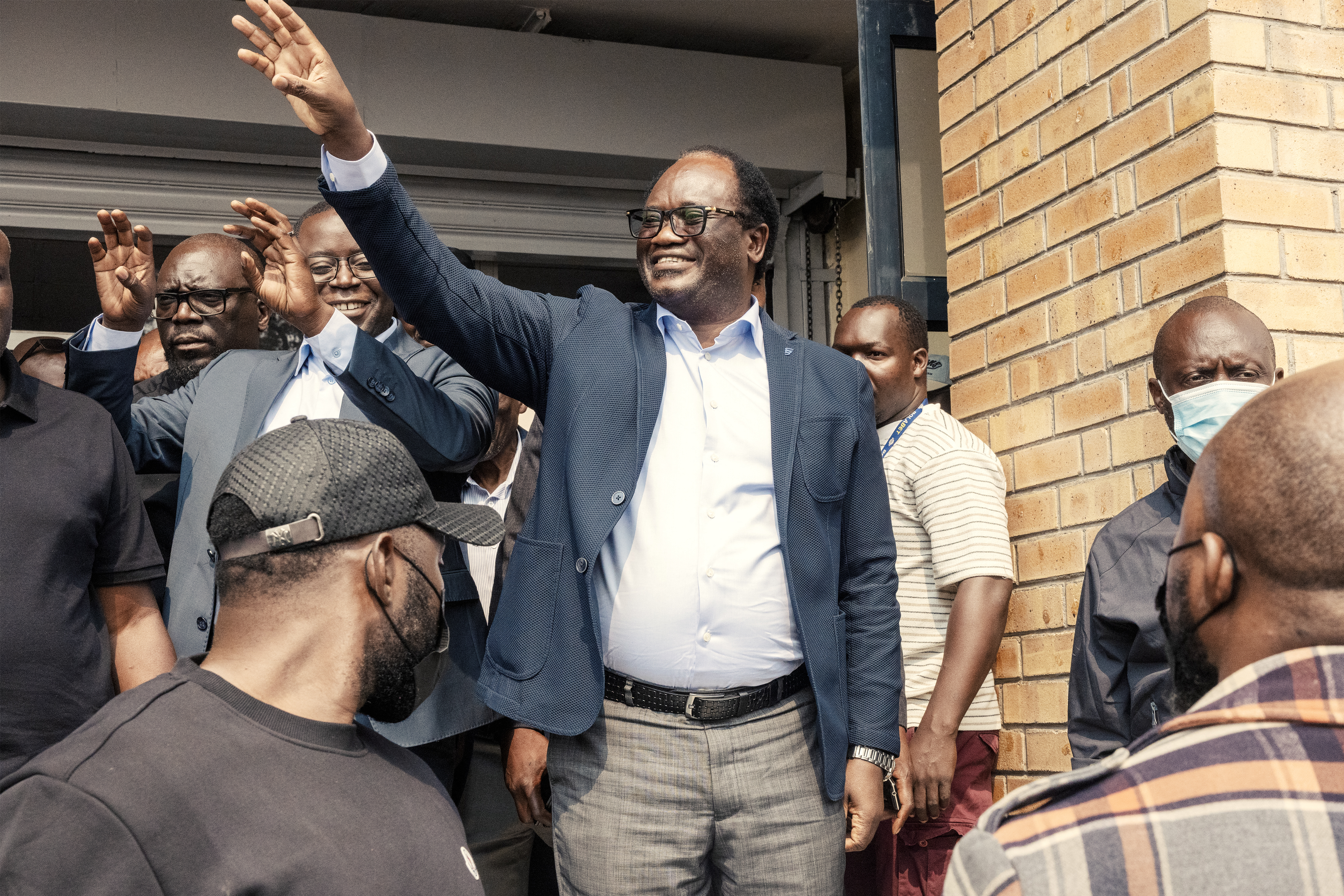 National Reconciliation Party for Unity and Prosperity (NRPUP) presidential candidate Brian Muntayalwa Mundubile waves at supporters as he leaves Hot FM radio station studios in Lusaka, on August 12, 2026.
