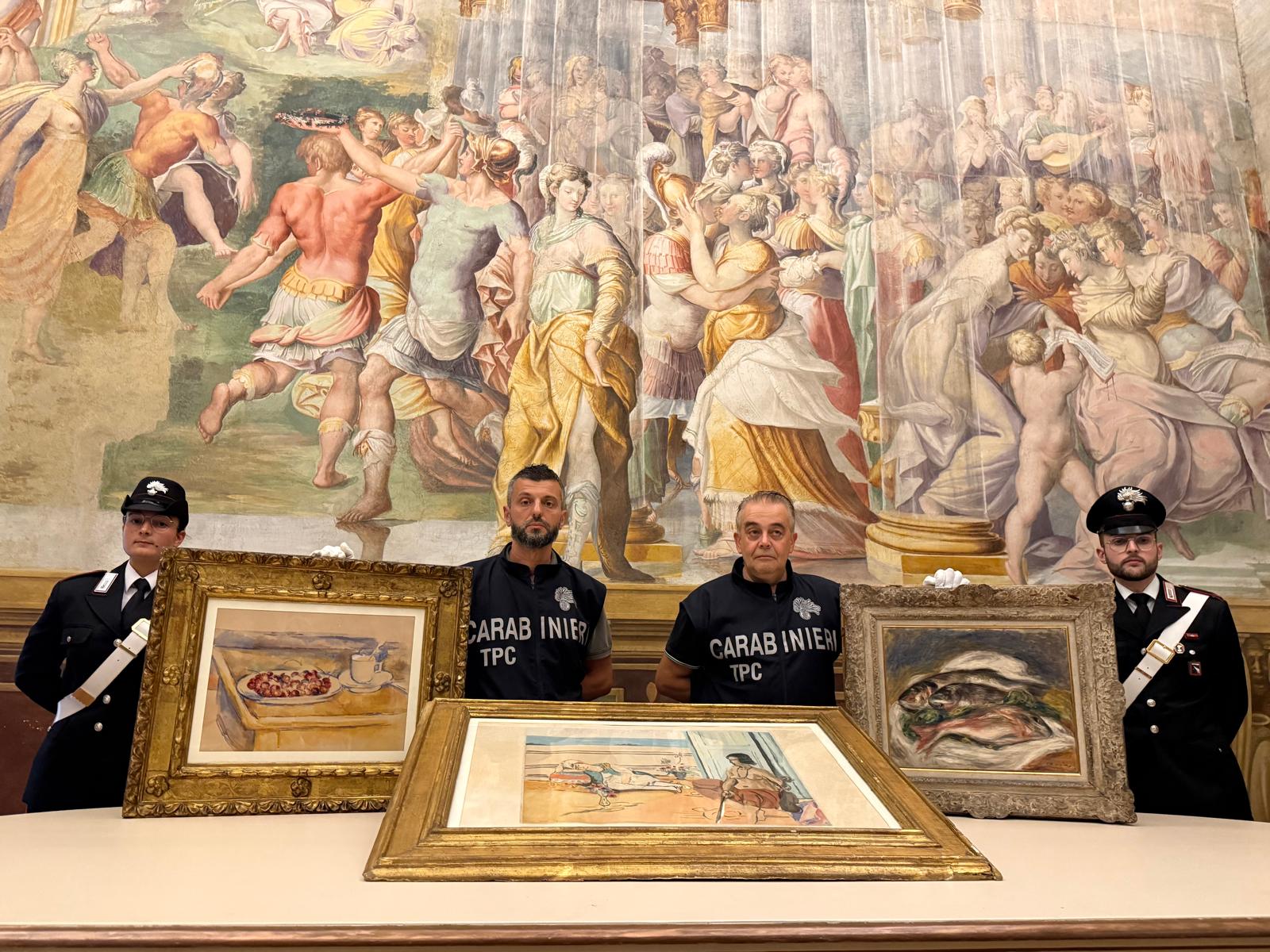 Carabinieri TPC art squad officers of the Parma Provincial Command posing with recovered valuable artworks stolen in March 2026, from the Fondazione Magnani Rocca Museum in Traversetolo, near Parma