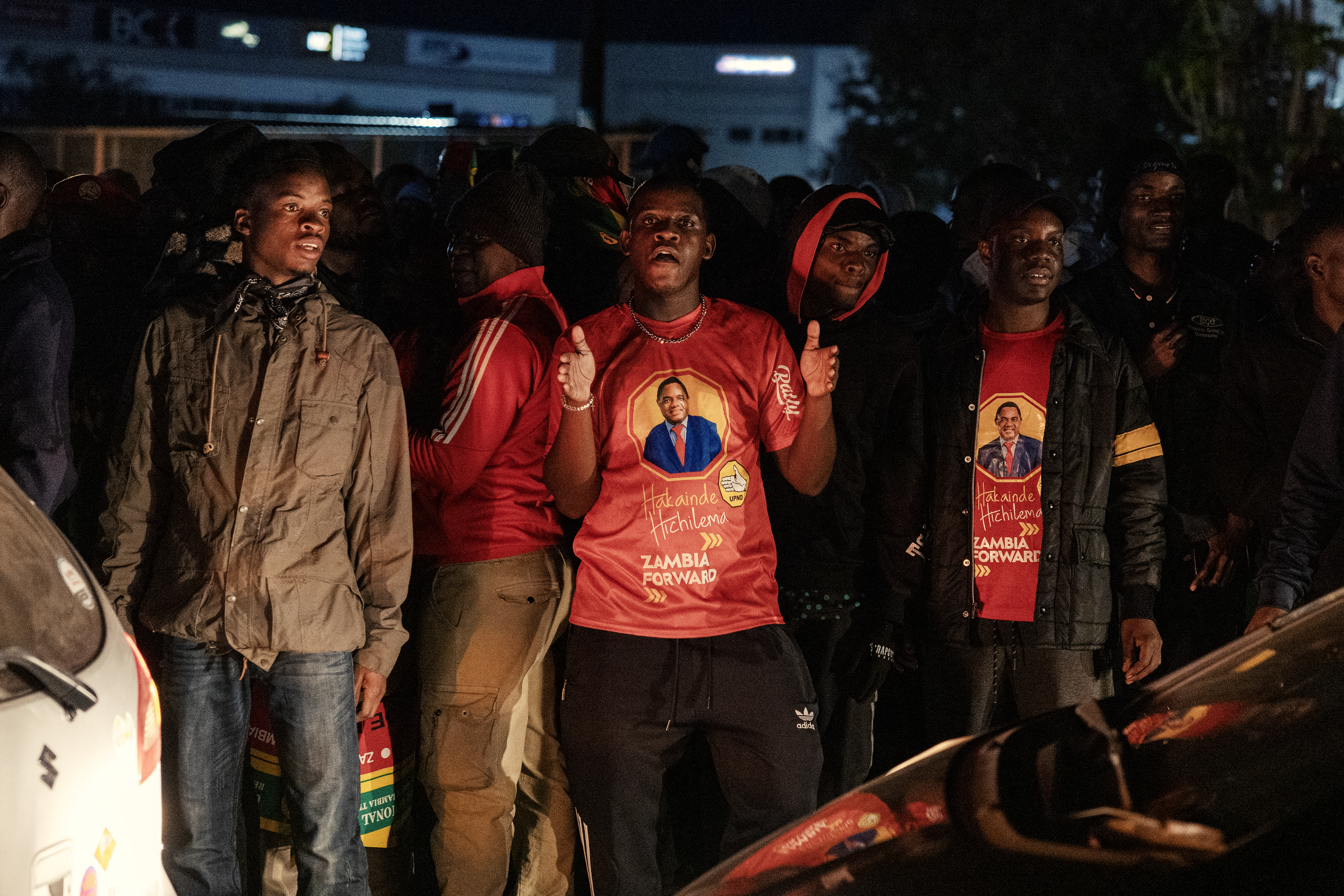 TOPSHOT - Supporters of Zambian President elect Hakainde Hichilema celebrate his victory in the street after the announcement of the Electoral Commission of Zambia in Lusaka, on August 18, 2026.