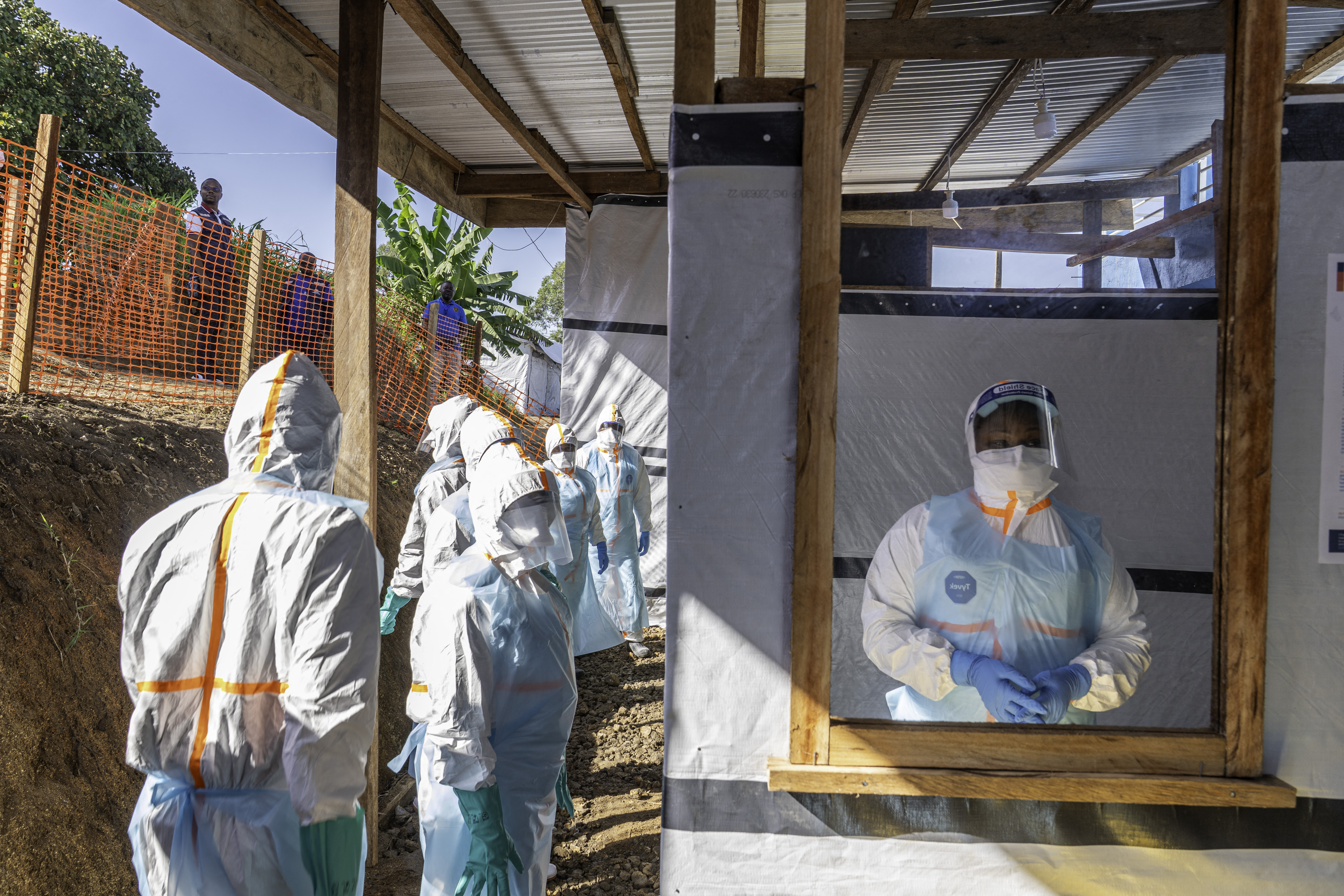 Health workers stand in a new Ebola treatment center during a visit of Tedros Adhanom Ghebreyesus, Director-General of the World Health Organization (WHO), in Bunia, in the northeastern Democratic Republic of the Congo. [May 31: AFP]