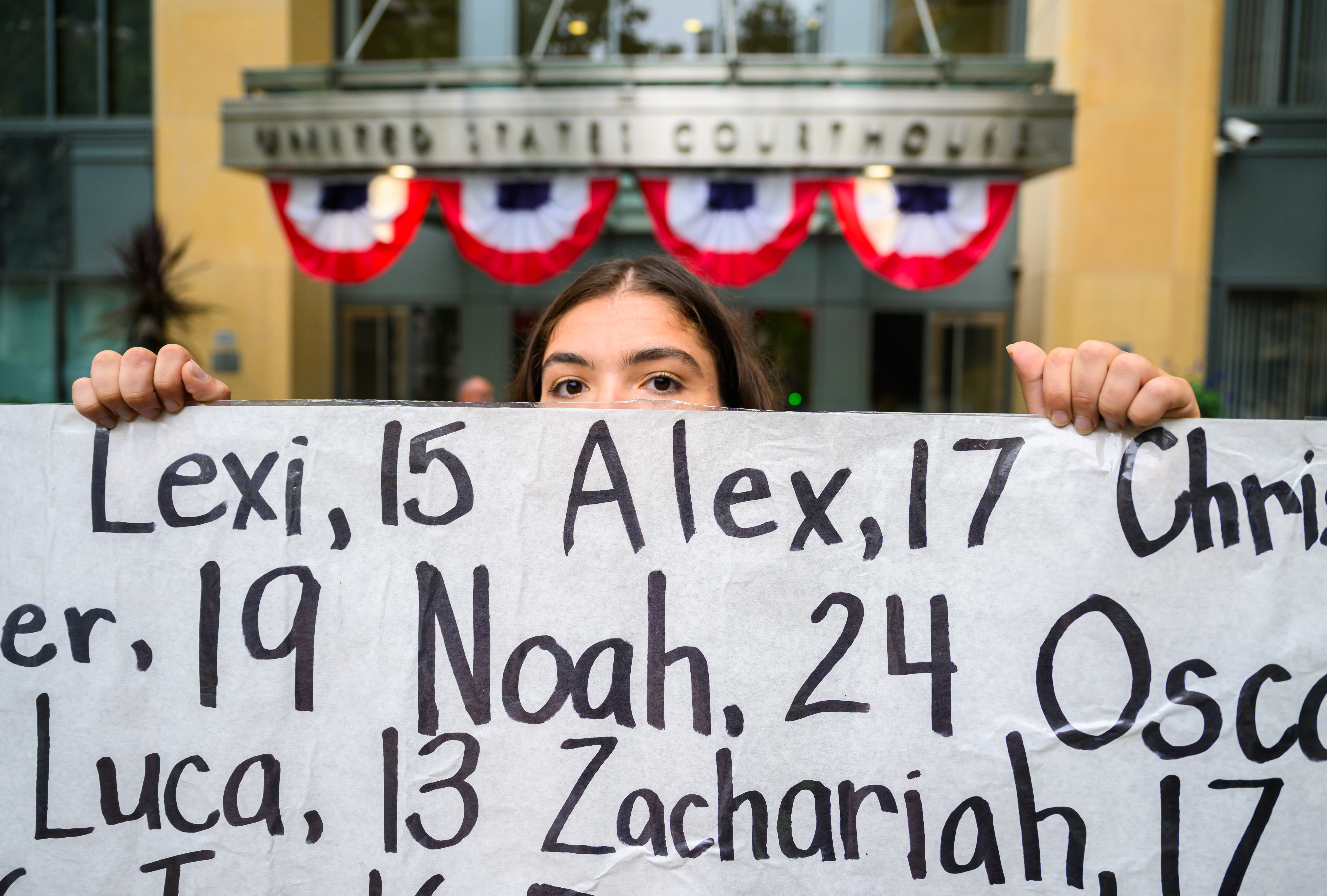 IMAGE DISTRIBUTED FOR HEAT INITIATIVE - Olivia Konar grieves while holding up a banner memorializing the loss of children who died due to social media harm during a press conference and memorial outside the Ronald V Dellums Courthouse on Tuesday, August 18, 2026 in Oakland, Calif. (Josh Edelson/AP Content Services for Heat Initiative)