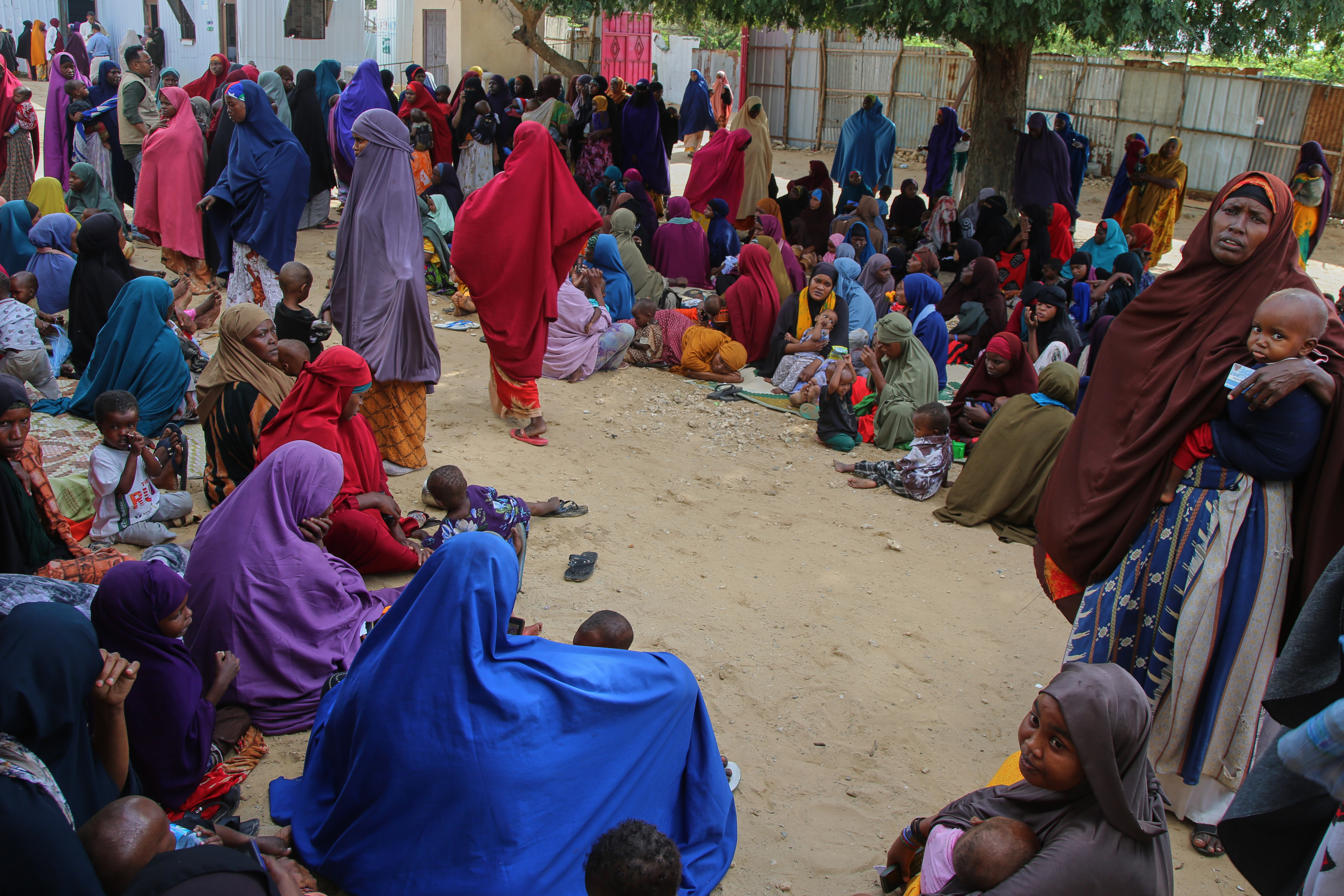 Somali women displaced by drought sit at Feynuus Nutrition Centre on the outskirts of the capital, Mogadishu, Somalia, Wednesday, Aug. 19, 2026. (AP Photo/Farah Abdi Warsameh)
