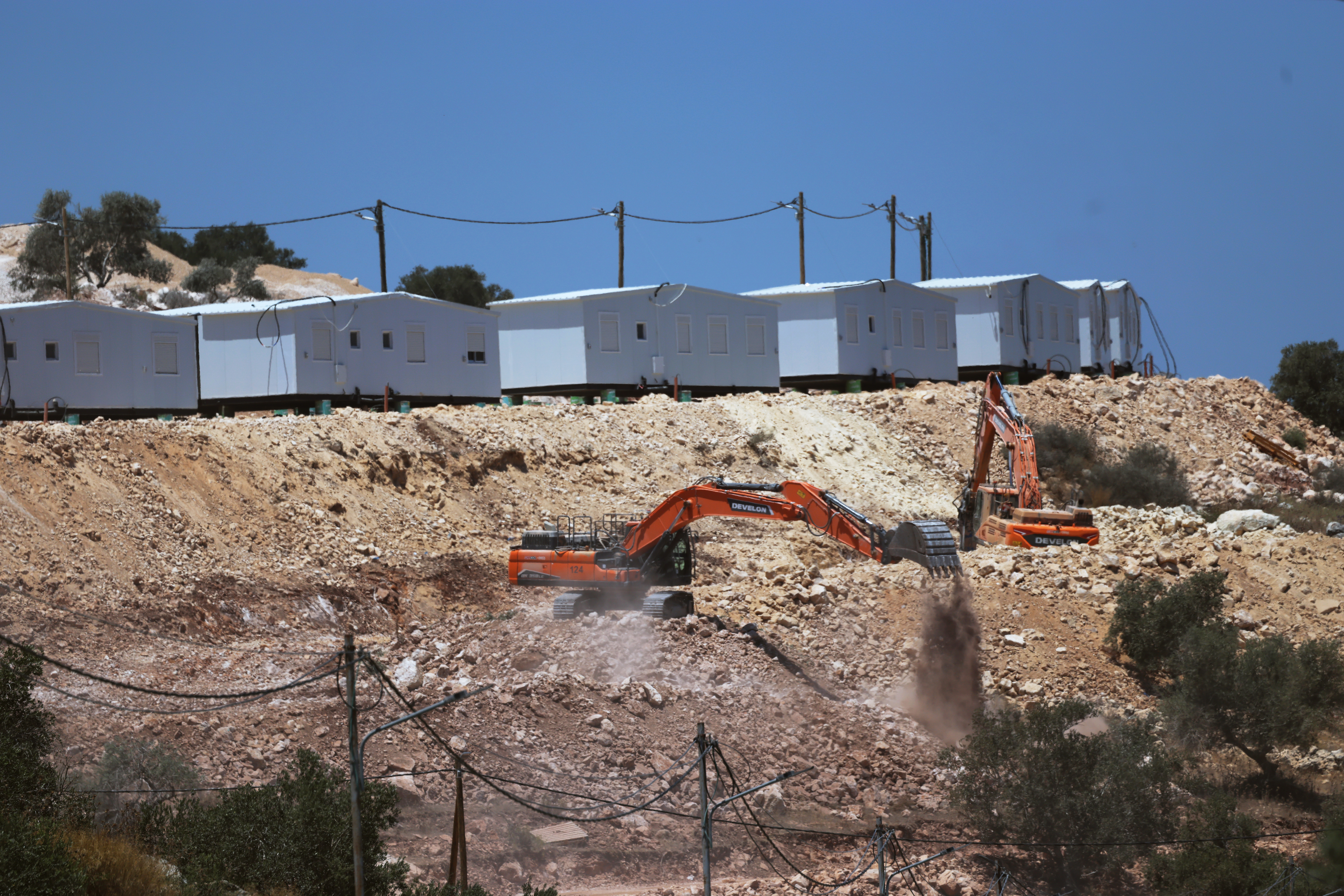 Israeli bulldozers prepare land for the construction of the new settlement of Dotan Valley, near the occupied West Bank city of Jenin