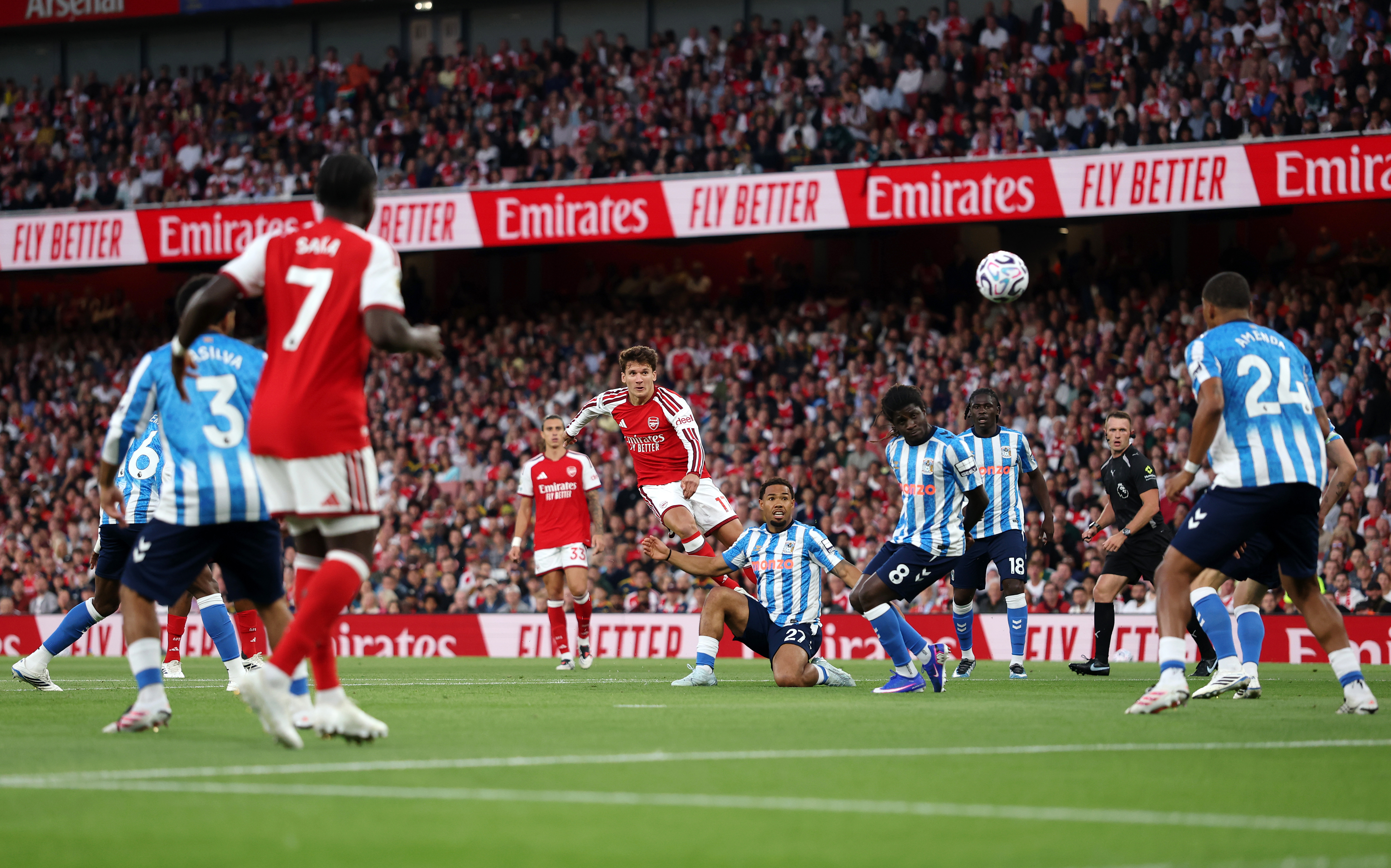 LONDON, ENGLAND - AUGUST 21: Christos Tzolis of Arsenal shoots under pressure from Milan van Ewijk of Coventry City during the Premier League 2026/27 match between Arsenal FC and Coventry City at Emirates Stadium on August 21, 2026 in London, England. (Photo by Julian Finney/Getty Images)