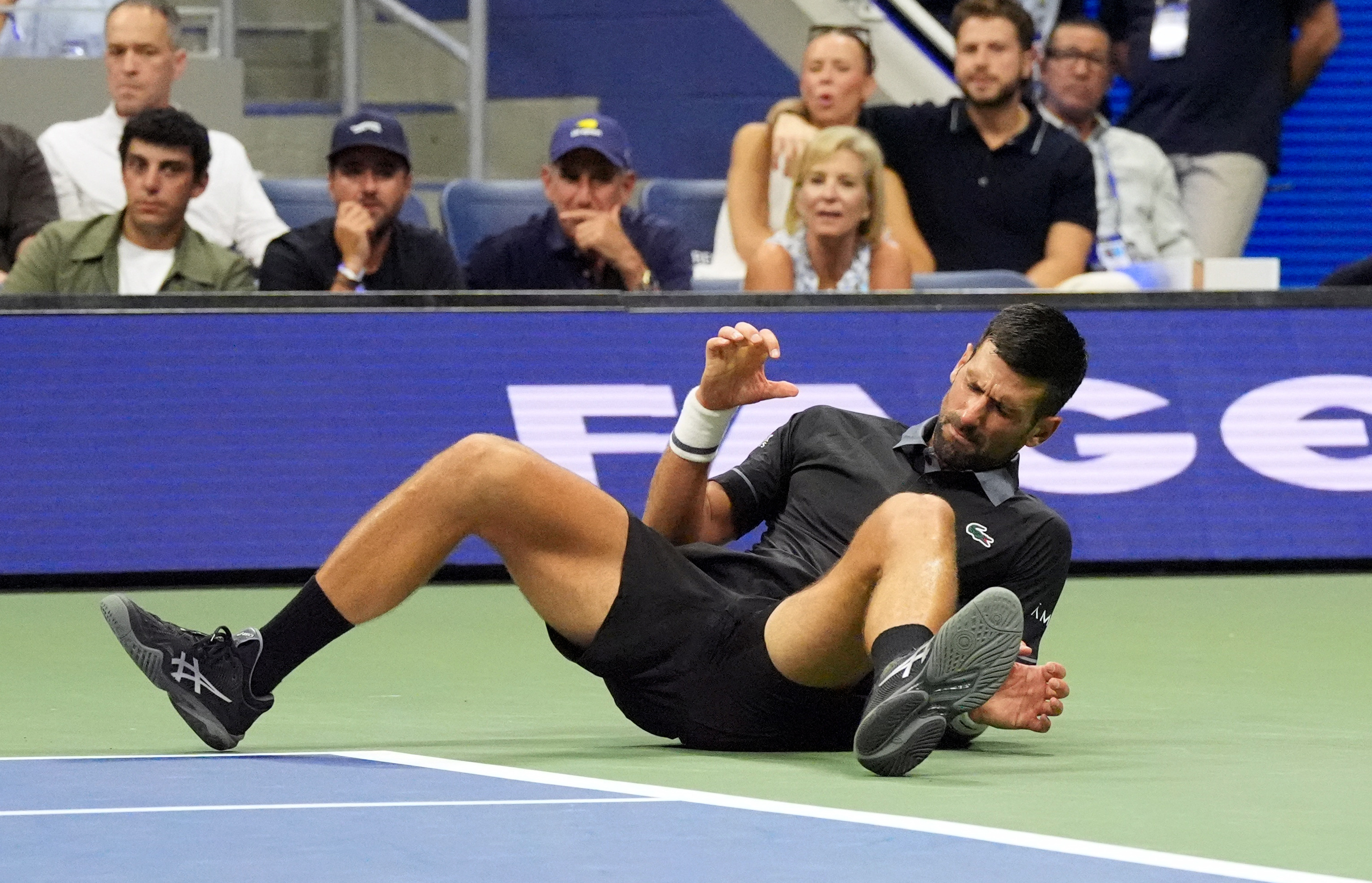 Tennis - U.S. Open - Flushing Meadows, New York, United States - August 30, 2026 Serbia's Novak Djokovic lies on the court during his first round match against Argentina's Mariano Navone IMAGN IMAGES via REUTERS/Robert Deutsch