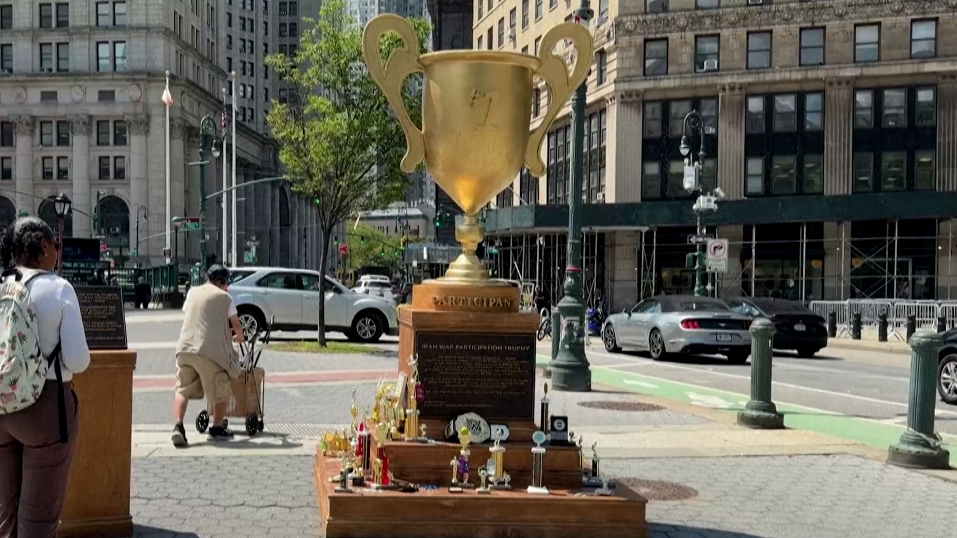 Giant golden 'participation trophy' statue in Foley Square, New York