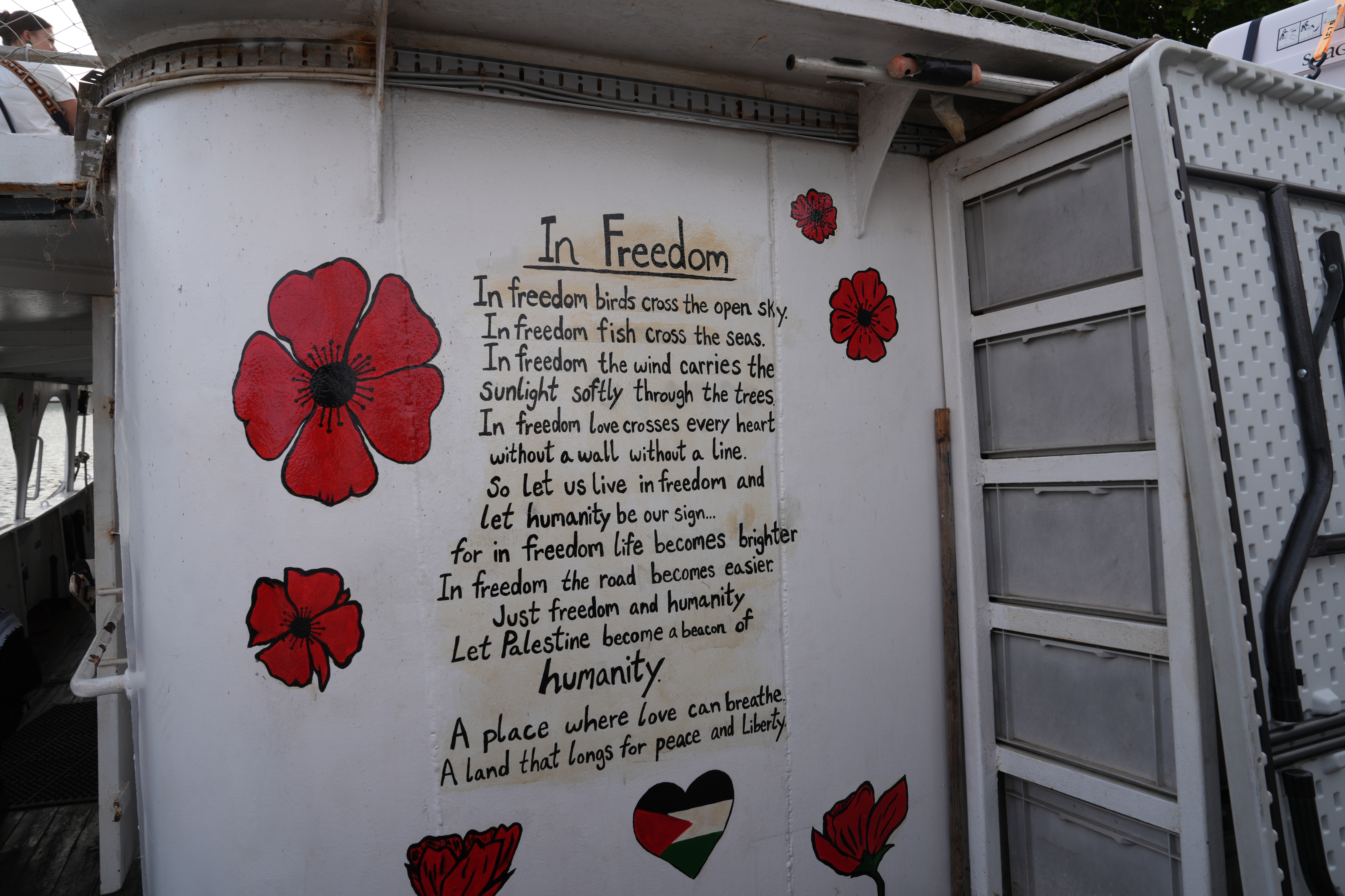 A poem, ‘In Freedom’, is written on the boat